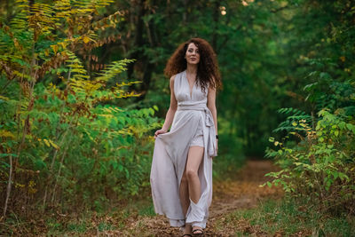 Woman standing in a forest