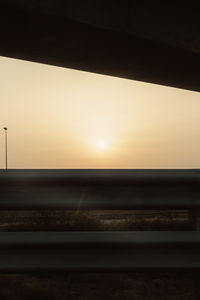 View of railroad track at sunset