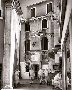 People sitting on chair in city