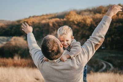 Father's day, happy loving family. father and son playing, having fun on the nature. happy family, 