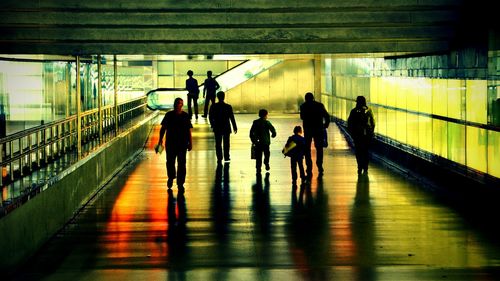 People walking on escalator