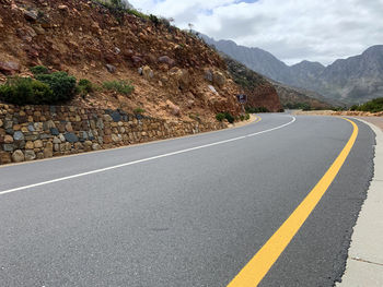 Surface level of road against mountain range