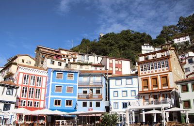 Buildings in city against sky