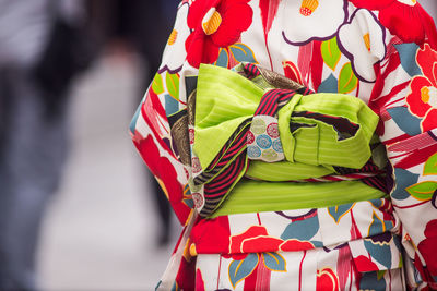 Rear view of woman with multi colored umbrella