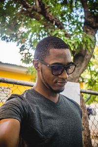 Portrait of young man wearing sunglasses