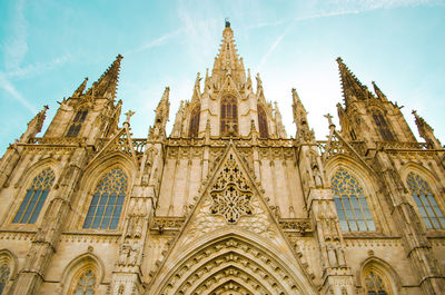 Low angle view of church in catalonia against sky