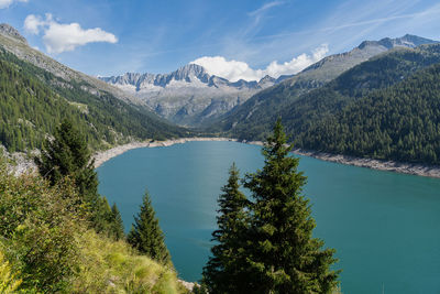 Scenic view of lake and mountains against sky