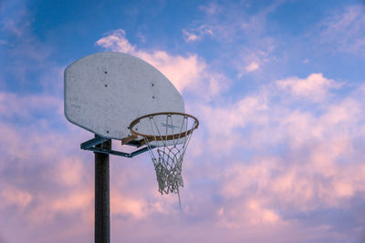 Low angle view of basketball hoop against sky