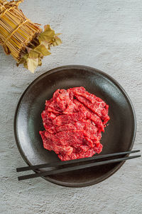 High angle view of meat in plate on table