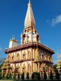 Low angle view of temple building against blue sky