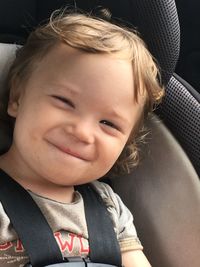 Portrait of smiling girl in car