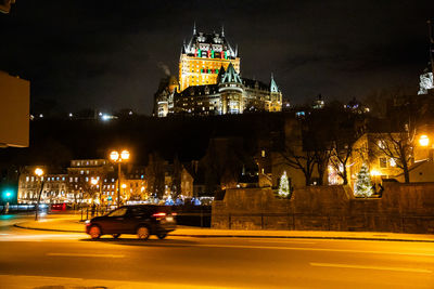 Illuminated buildings in city at night