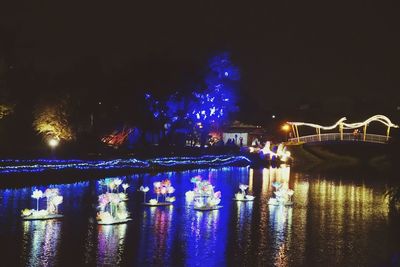 Reflection of illuminated buildings in water