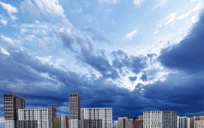 Buildings in city against sky