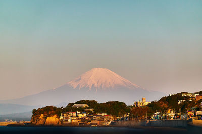 Scenic view of snowcapped mountains against sky during sunrise