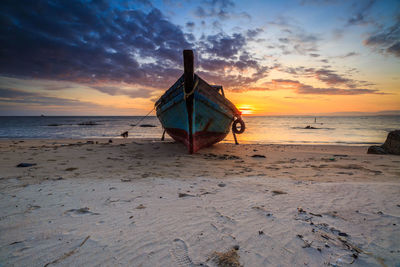 Scenic view of beach against sky during sunset