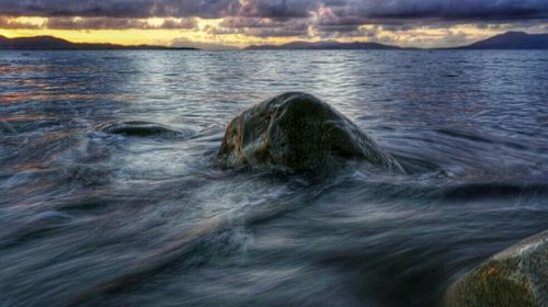 Scenic view of sea at sunset