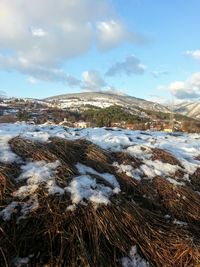 Scenic view of snowcapped mountains against sky