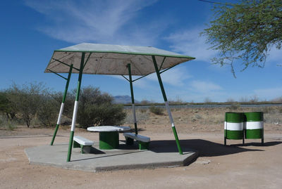 Lifeguard hut on beach against sky