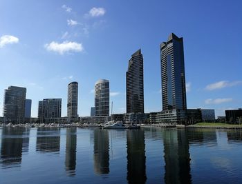 Modern buildings in city against sky