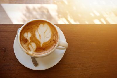 High angle view of cappuccino on table