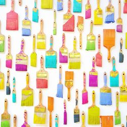 Full frame shot of paintbrushes hanging on wall