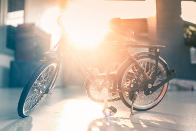 Close-up of bicycle on sunny day