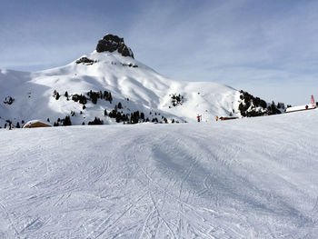 Scenic view of snowcapped mountains against sky