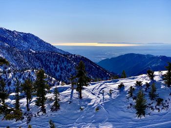 Scenic view of snowcapped mountains against sky during winter