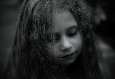 Close-up of sad girl standing outdoors