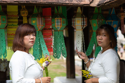 Portrait of young couple looking at camera