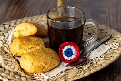 Close-up of coffee and cookies on table