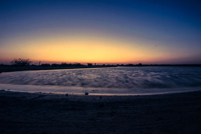 Scenic view of landscape at sunset