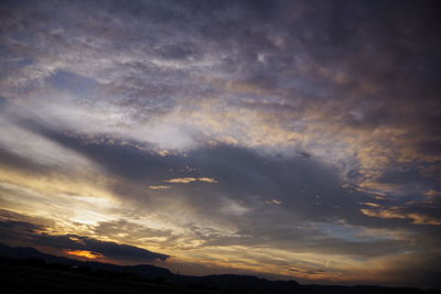 Low angle view of dramatic sky during sunset