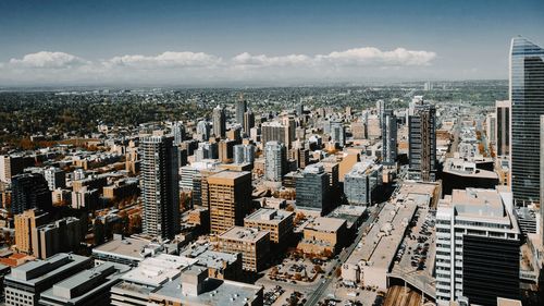 High angle view of modern buildings in city against sky