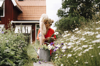 Mother and daughter in garden