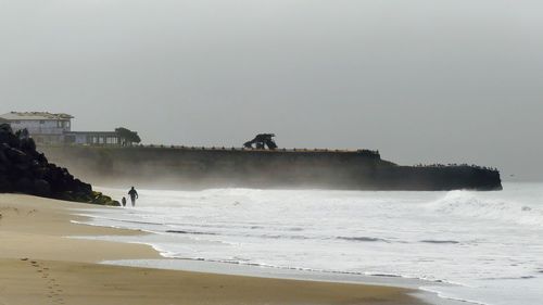 Scenic view of beach against clear sky