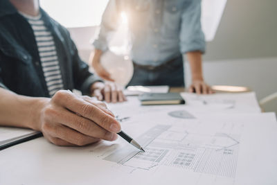 People working in pen on table