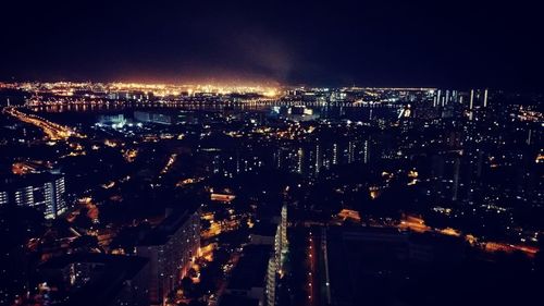 Aerial view of illuminated cityscape at night