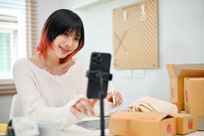 Young woman using mobile phone