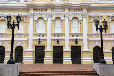 Statue against historic building