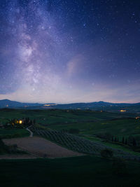 Scenic view of field against sky at night