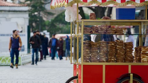 People for sale at market stall in city
