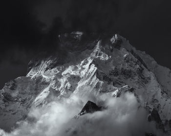 Aerial view of snowcapped mountains against sky