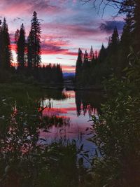 Scenic view of lake against sky at sunset