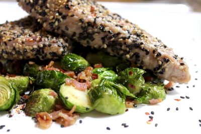 Close-up of tuna and brussels sprouts served in plate