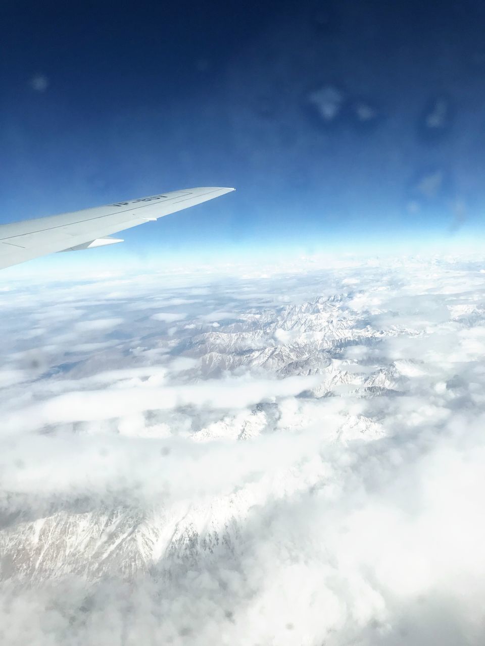 aerial view, cloud - sky, nature, airplane, sky, beauty in nature, cloudscape, airplane wing, scenics, tranquil scene, tranquility, blue, day, no people, transportation, outdoors, journey, mid-air, flying, sky only, the natural world