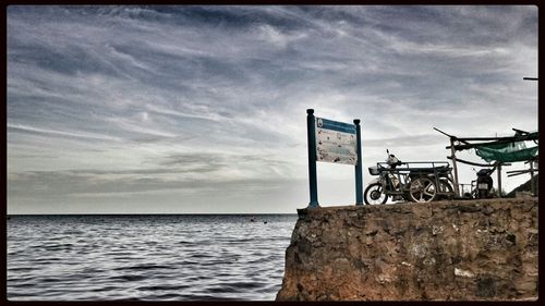 Scenic view of sea against cloudy sky