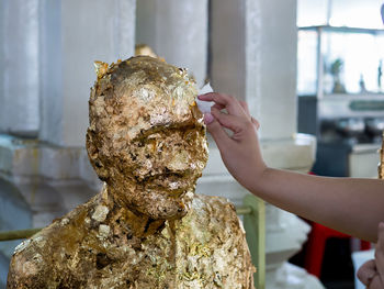 Close-up of hand holding ice cream cone