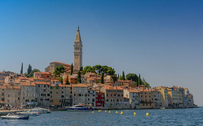 View of buildings against blue sky